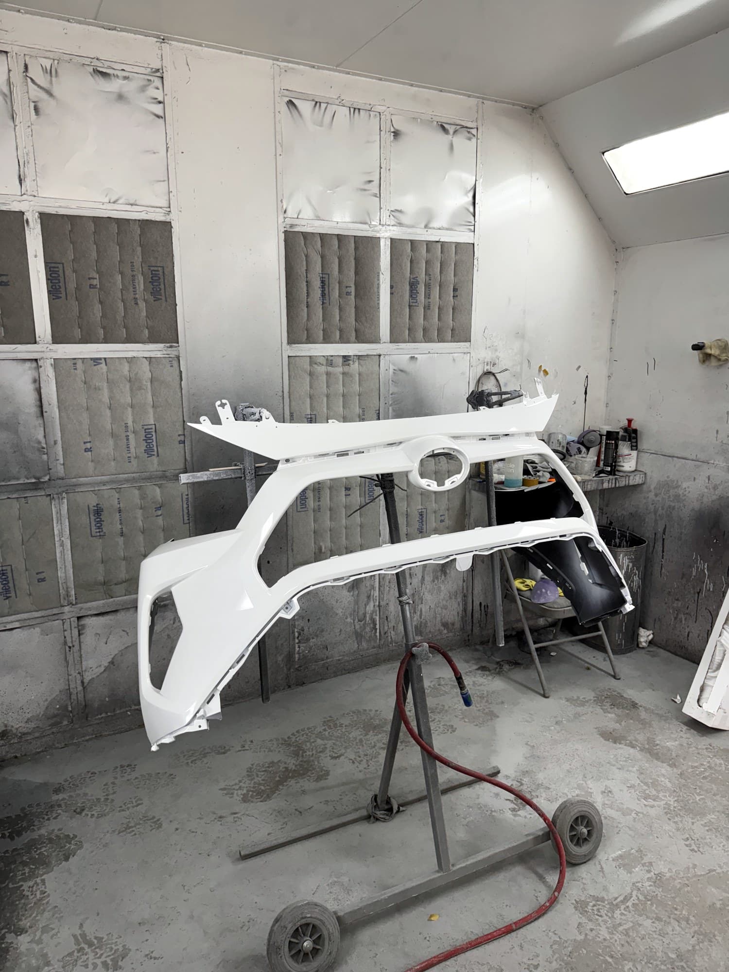 Fresh white panels on the stand in the paint booth